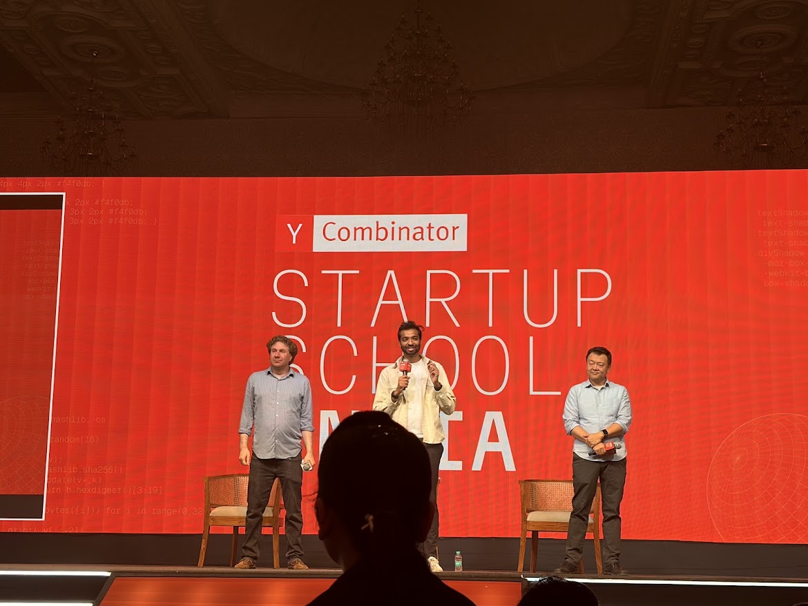 YC General Partners Jared Friedman, Ankit Gupta, and Jon Xu on stage